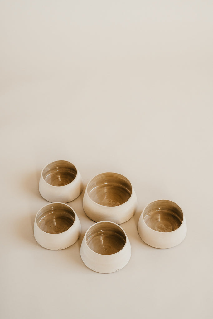 large dried floral arrangement in cream ceramic vase