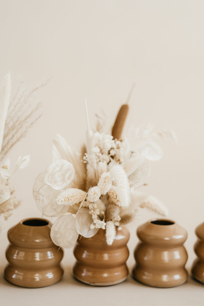 mini dried floral arrangement in camel ceramic vase